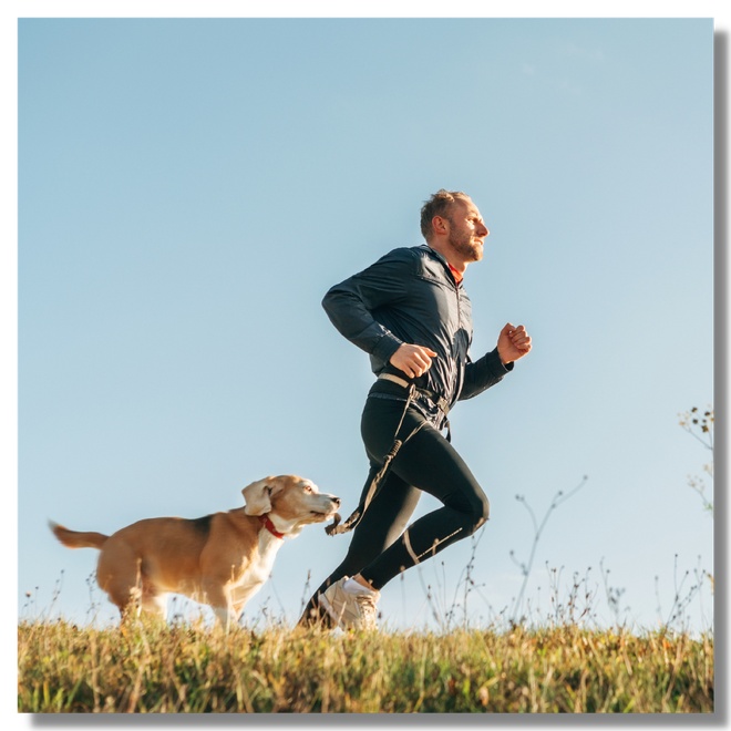 A men running with his dog