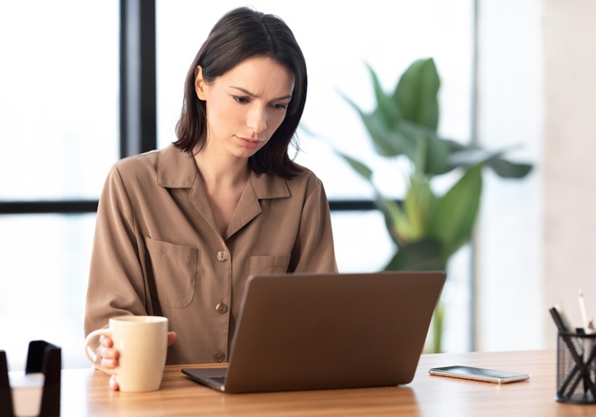 A women creating a lost pet poster on her computer
