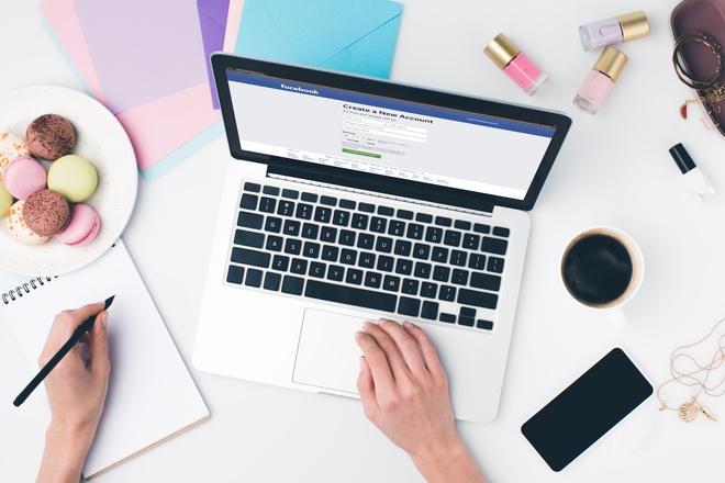 top view of woman using laptop and writing in note wblqgsu